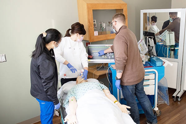 Medical students perform a procedure at Memorial hospital