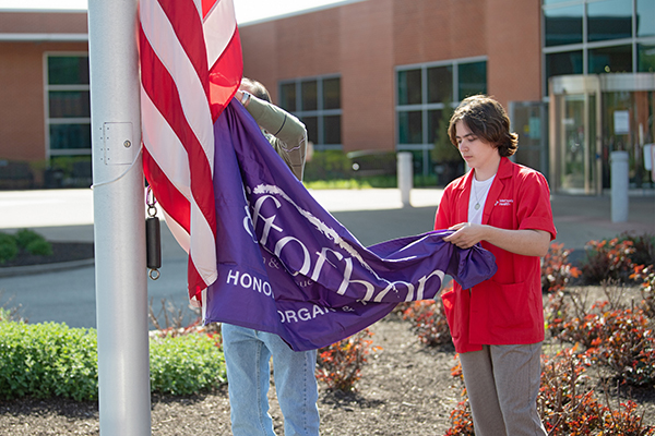 Lincoln Memorial Hospital volunteer, Rachel Morrow, and colleague raise Gift of Hope flag