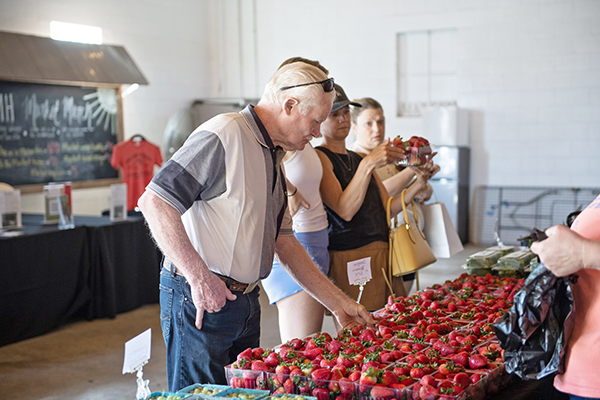 Community members shop at the LMH Market